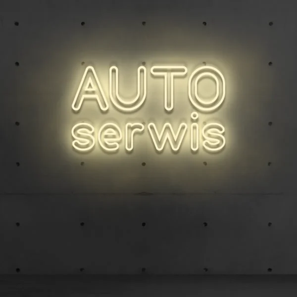 Beżowy neonowy napis „AUTO serwis” na ścianie