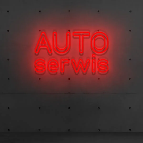 Czerwony neon „AUTO serwis” widoczny szyld serwisu
