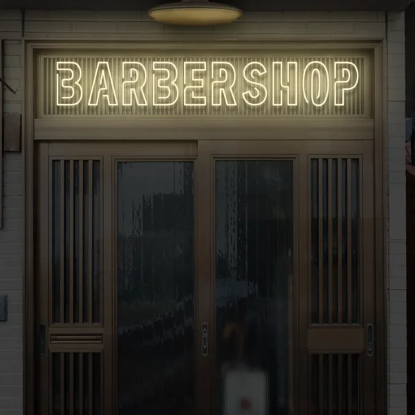 Beżowy neonowy napis BARBERSHOP dekoracja fasady