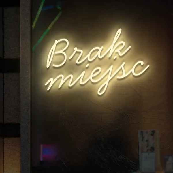 Beżowy neonowy napis Brak miejsc na witrynie