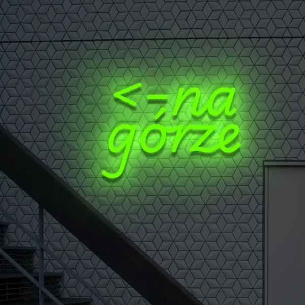 Zielony neon „na górze” świetlny znak ze strzałką