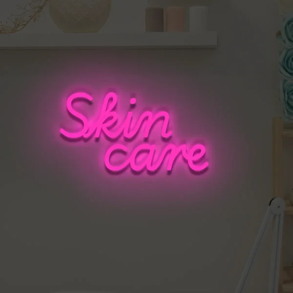 Różowy neon LED z napisem Skin care dekoracja wnętrza