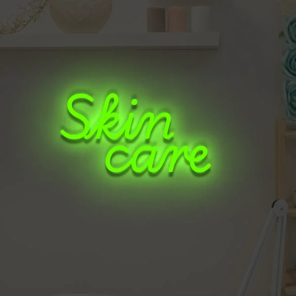 Zielony neonowy napis Skin care świecąca dekoracja ścienna