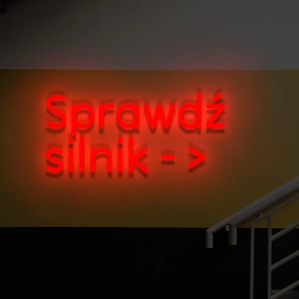 Czerwony neon „Sprawdź silnik →” wyraźna tablica informacyjna