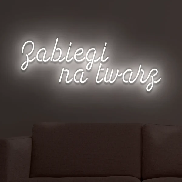 Biały neon LED z napisem Zabiegi na twarz na ścianie
